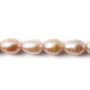 Salmon color oval freshwater pearls on thread 8x10mm x 40cm