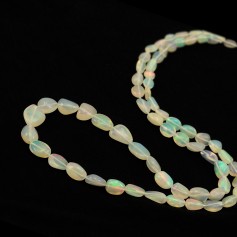 Ethiopian oval baroque opal 5x7 - 8x12mm x 50cm