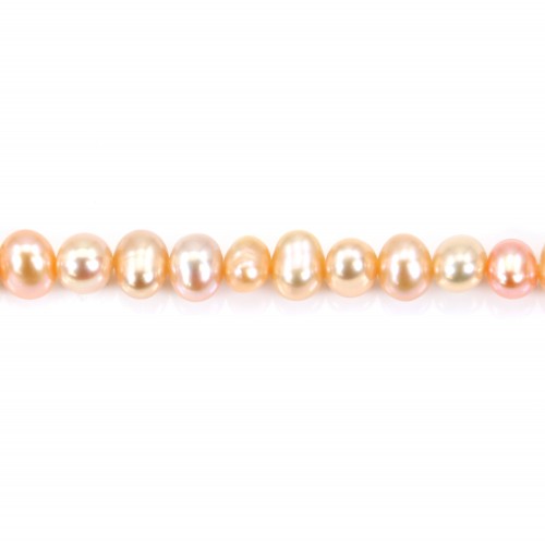 Freshwater cultured pearl, salmon color, oval, 5-6mm x 36cm
